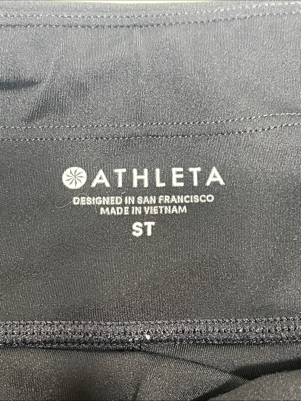 Athleta ST Black 7/8 Leggings Reflective Trim Zip Pocket Tall - Picture 2 of 8
